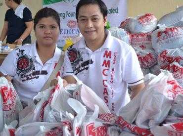 Mr. Rollie Luy, Guidance Officer and Ms.Ellen Cabrera helping with the preparations for the relief distribution